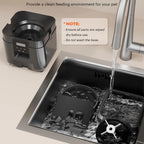 Removable feeder bowl and hopper parts being rinsed in a sink